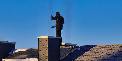 illustration of a chimney sweep character standing on a brick chimney with a union jack flag and surrounded by text National Association of Chimney Sweeps representing safety and quality for 6 chimney cleaning services