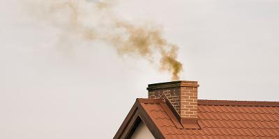 stork standing on large nest atop chimney under clear sky symbolizing family and nature 2 eggs and nest 2 wildlife